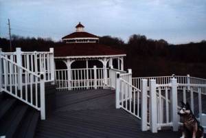 gazebo with white railing and deck